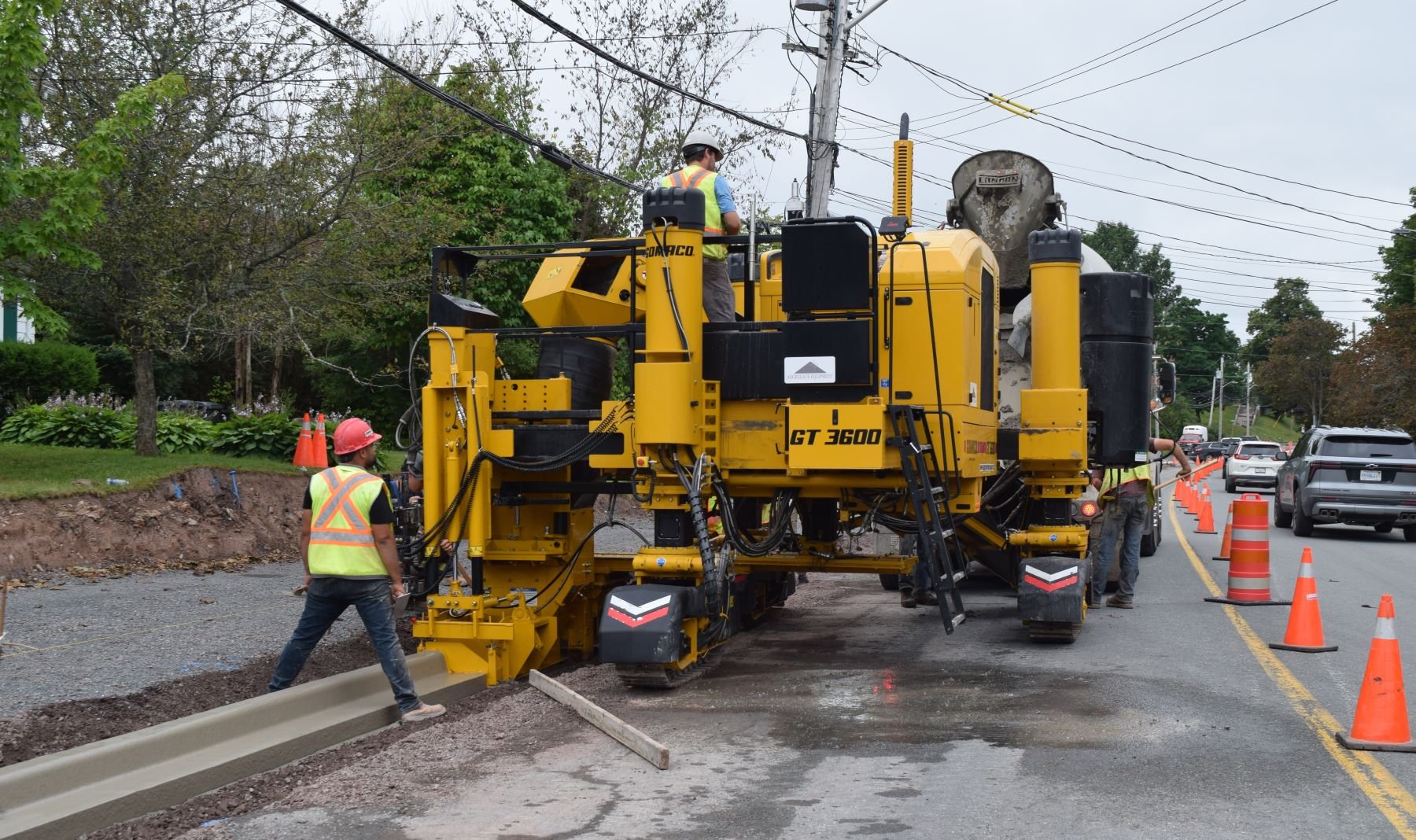 Curb Machine placing fresh curb along St. Ninian Street